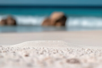 Fototapeta na wymiar Selective focus of white sand on beautiful beach background.