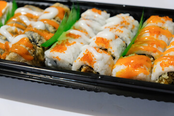 various kinds of sushi served in a container