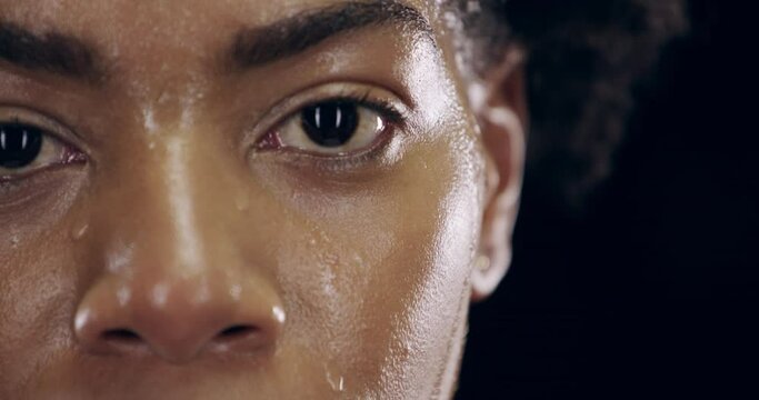Black woman, face and sweating with breathing and rest after fitness, workout and training. Athlete focus portrait, black background and African female person with sweat and breathe from sports