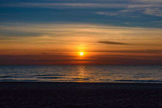 Spectacular bright golden sunset over Baltic sea