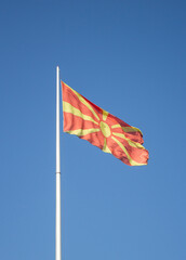 The north nacedonia republic flag waving in the blue sky