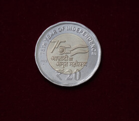 selective focus view of a new twenty Rupee Indian Coin released in 2022 commemorates
 75 years of Indian independence (Azadi ka Amrit Mahotsav)  - obrazy, fototapety, plakaty