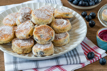 Traditional fennel Welsh cakes with blueberry coulis