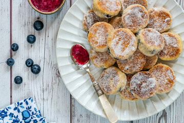 Traditional fennel Welsh cakes with blueberry coulis