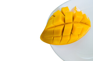 Ripe gold mango slice on white plate well free space for text 