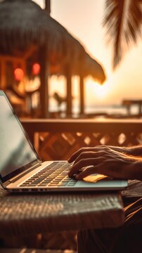 Closeup of unrecognizable digital nomad typing on laptop at the beach showcasing the concept of making money online, sunset, vertical, generative ai