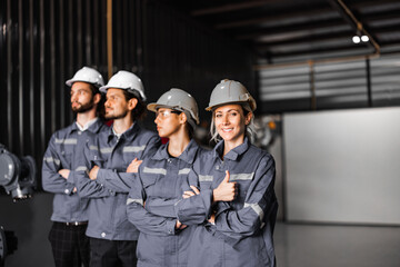 Confident robotic team, including women in non typically male-dominated field, crosses arms representing company's commitment to diversity and inclusion that accepts people all genders and cultures