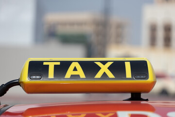 taxi sign on the car