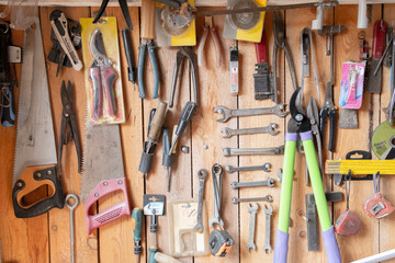 Tools on the wooden wall of the barn