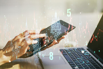 Multi exposure of abstract financial graph and hand working with a digital tablet on background,...