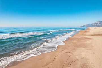 Beautiful Patara sandy beach with blue sea Kalkan, Antalya Turkey. Aerial top view from drone