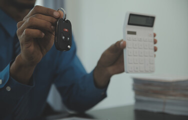 Man signing car insurance document or lease paper. Writing signature on contract or agreement....