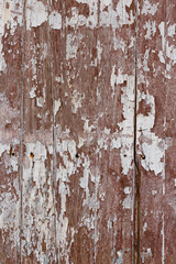 Old wooden with peeling paint background texture