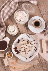 Neapolitan wafers filling with hazelnut-chocolate cream. - 607098810