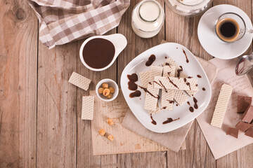 Neapolitan wafers filling with hazelnut-chocolate cream. - 607098853