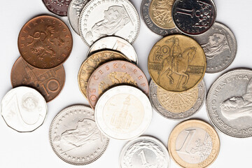 euro currency, czech crowns currency, swiss francs currency and polish zloty currency coins on white background