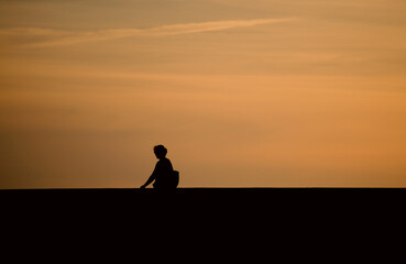 Silhouette of person at sunset