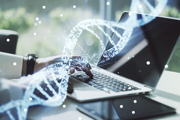 Creative DNA sketch and hands typing on computer keyboard on background, biotechnology and genetic...