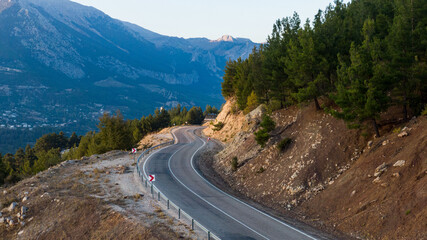 Aerial view of road between green summer forest Turkei