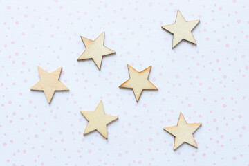 Obraz premium star wooden embellishments arranged on scrapbook paper