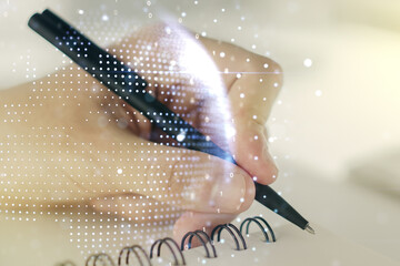 Multi exposure of abstract creative digital world map and man hand writing in notebook on...