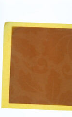 yellow and brown scrapbook paper with decor detailing 
