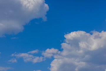 Naklejka na ściany i meble Beautiful view of white clouds in blue sky.