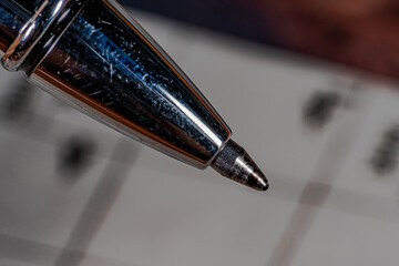 Close-up detail of ballpoint pen tip. Close up macro shot. Horizontal macro photography view.