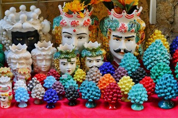 traditional Sicilian ceramics representing the couple of Moor's heads and the pine cone hissing of...