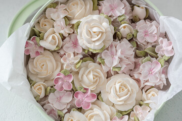 Zephyr bouquet of flowers in a gift box on a light background