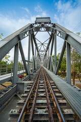 Fototapeta premium Old railway iron bridge in countryside at Ban Dara, Pichai District, Uttaradit, Thailand. Name is Paramin Bridge also known as Baan Dara Bridge It is a railway bridge over the Nan River