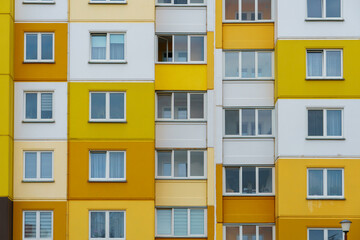 Modern residential multi-storey building. Windows and balconies on a new residential building close-up. Buying and selling apartments, rental housing, happy family life in a comfortable apartment.