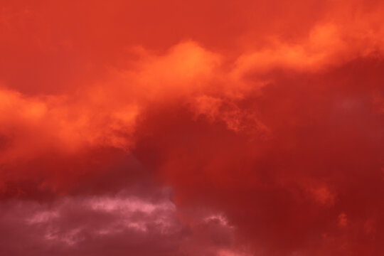 Fantastic surreal bright sky with clouds in red and pink colors