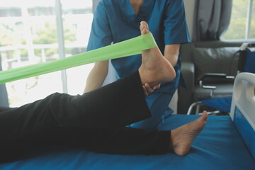 Physiotherapist working with patient in clinic, closeup