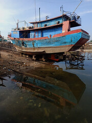 Docking of wooden fishing boats on the dock for repair and maintenance. Maritime Industry and Marine Fisheries