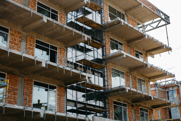Sun rays light effects on urban buildings. Fragment of modern residential apartment with flat buildings exterior. Detail of new luxury house and home complex