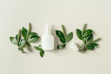 Seasonal allergy concept, spring young branches tree with new green leaves and catkins and white...