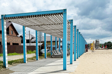 Wooden canopy on the sandy beach. Beach Day © Алина Курочкина