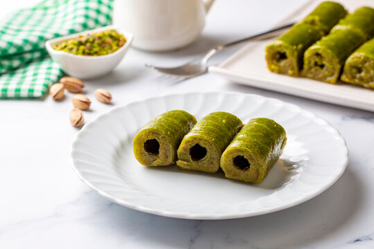 Pistachio baklava. Traditional Middle Eastern Flavors. The local name of Baklava is Fıstıklı Baklava or fıstıklı dolama. Turkish style pistachio baklava presentation and service