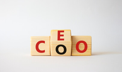 CEO and COO symbol. Turned wooden cubes with words CEO and COO. Beautiful white background. CEO and COO and business concept. Copy space