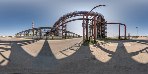 spherical 360 hdri panorama near industrial architecture and communications, pipes and metal...