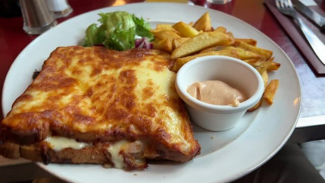 delicious Croque Monsieur toast with French Fries in Paris, France