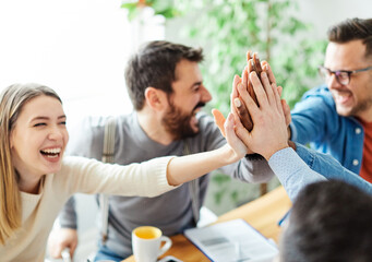 businessman businesswoman success young business team high five support unity celebrating give me...