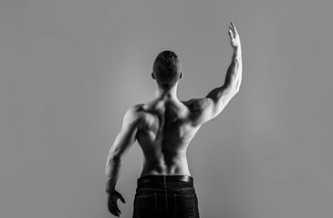 Man muscular arms, triceps. Waist, waistline. Guy with beautiful torso. Muscular back, muscular man, muscled back, naked torso. Black and white