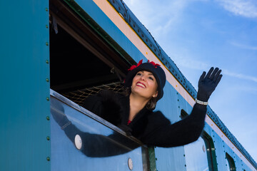 1920s woman waving from train