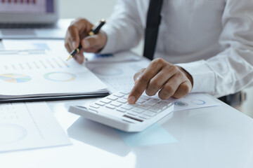 Obraz premium Asian businessman working with finance marketing chart and advisor showing plan of investment to clients at table office. Digital marketing.