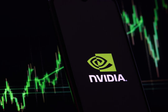 Nvidia investment growth and profit trading concept. Nvidia company logo on screen of smartphone against blurred background of up trading stock chart. USA, May 26, 2023