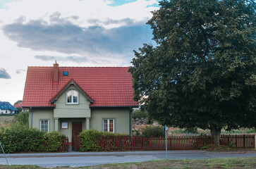 Tidy Green Cottage with a Low Fence, Tree on the Side