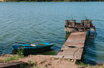 Sunny Day by the Lake or River: Landscape with Ducks Swimming, Boat Dock, and a Leisure Pier