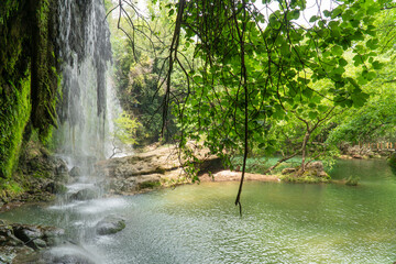 Naklejka premium waterfall in the forest. Kursunlu Waterfalls in Antalya, Türkiye. selective focus